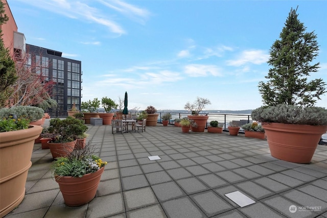 view of patio with a water view