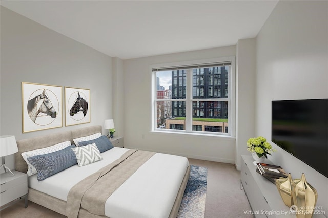 bedroom featuring light colored carpet