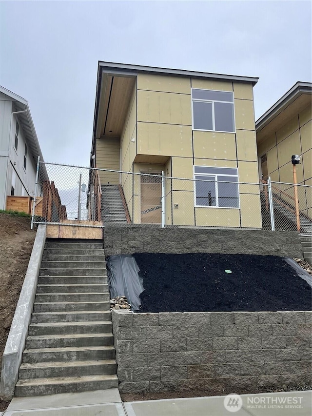 exterior space with stairway and fence