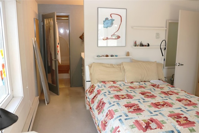 bedroom featuring carpet flooring and baseboard heating