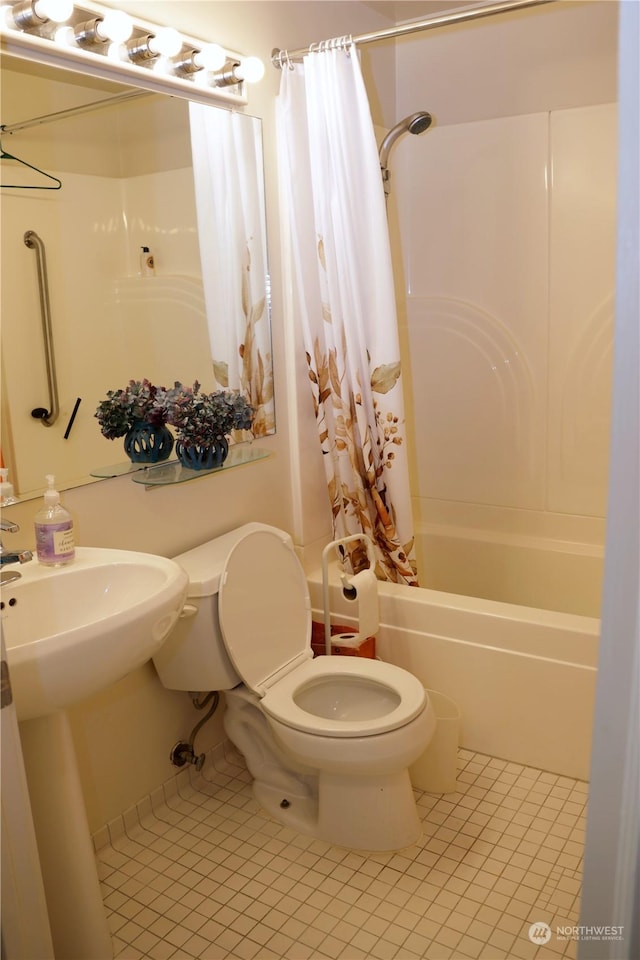 bathroom featuring tile patterned floors, toilet, and shower / bathtub combination with curtain