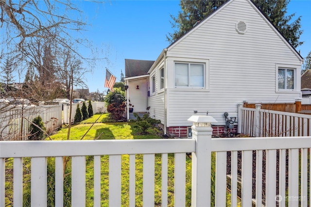 view of property exterior featuring a yard