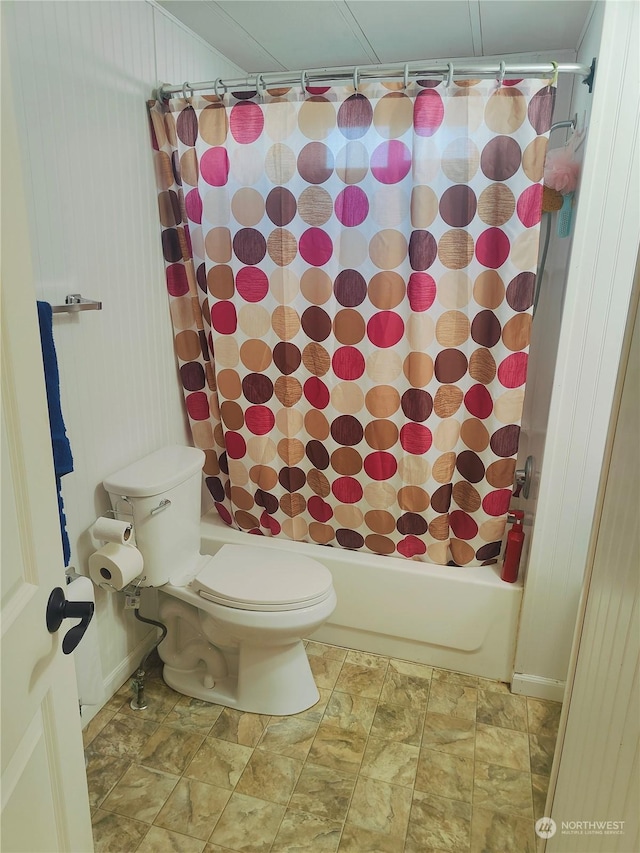 bathroom with toilet and shower / bath combo