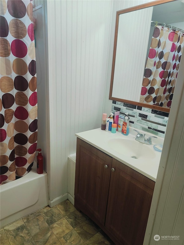 bathroom featuring vanity and shower / bath combo