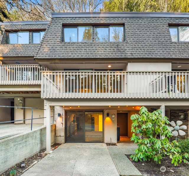 view of front of house featuring a balcony