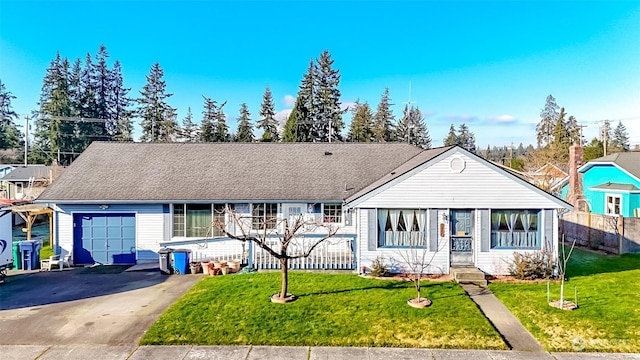 ranch-style house with a garage and a front lawn