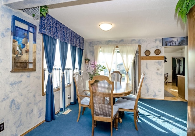 view of carpeted dining space