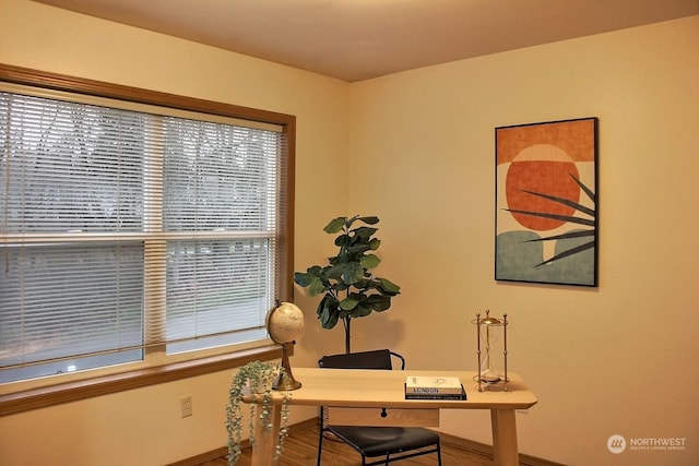 home office with wood-type flooring