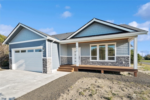 view of front of property featuring a garage and covered porch