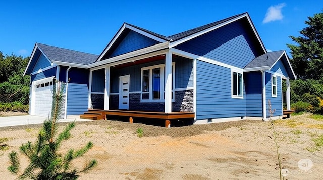 998 Cascade Ave SW, Ocean Shores, WA 98569 - single story home with covered porch, an attached garage, and driveway