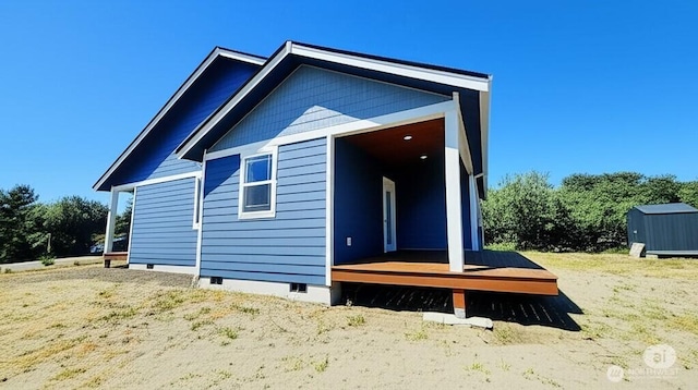998 Cascade Ave SW, Ocean Shores, WA 98569 - rear view of house with crawl space