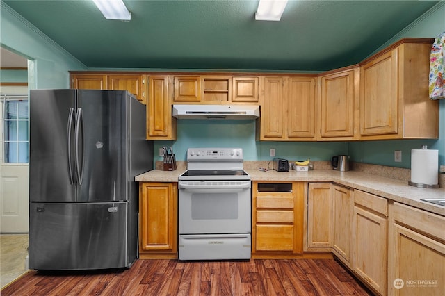 kitchen with ornamental molding, dark hardwood / wood-style floors, stainless steel fridge, and white range with electric cooktop