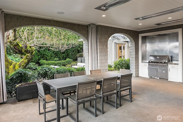 view of patio featuring a grill, visible vents, and outdoor dining area