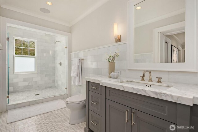 bathroom featuring ornamental molding, a stall shower, and toilet