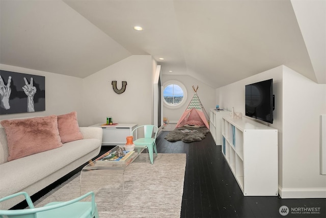 living area featuring vaulted ceiling, recessed lighting, hardwood / wood-style flooring, and baseboards