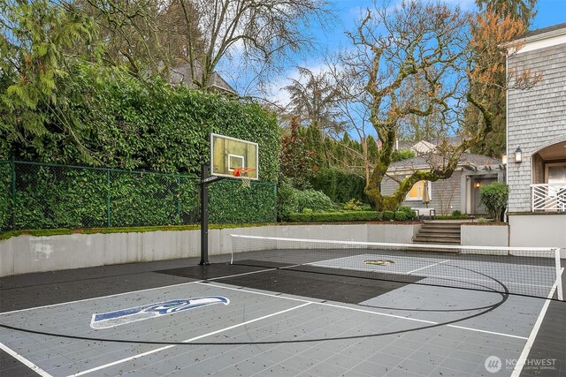 view of sport court featuring community basketball court and fence