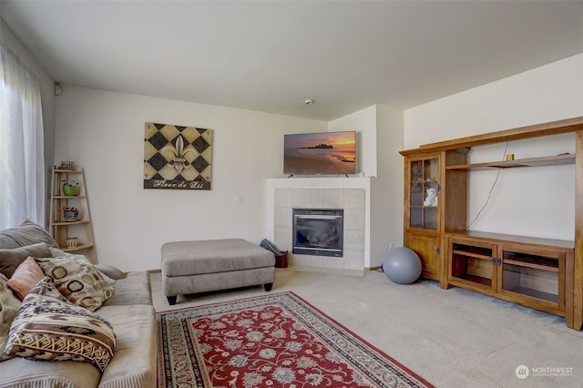 carpeted living room featuring a fireplace