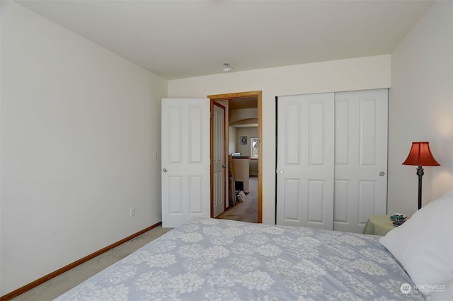 carpeted bedroom with a closet