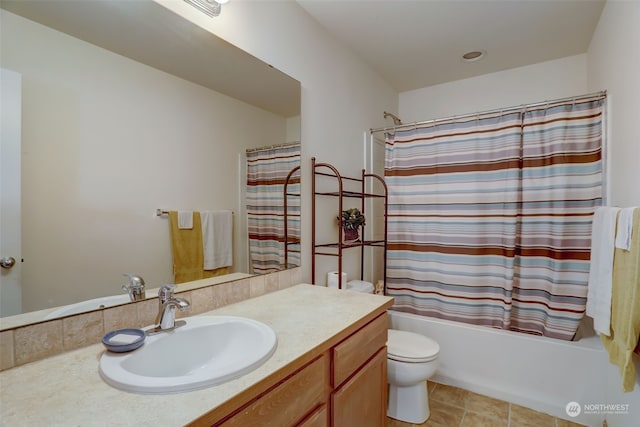 full bathroom with toilet, tile patterned flooring, shower / bath combo, and vanity