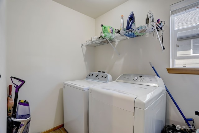 clothes washing area featuring washer and dryer