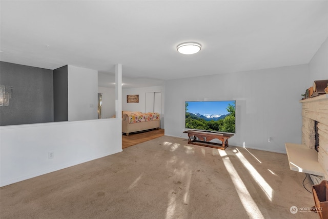 unfurnished living room featuring light carpet