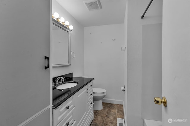 bathroom with toilet and vanity