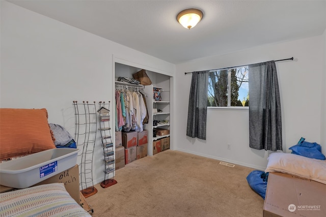 bedroom featuring a closet and carpet flooring