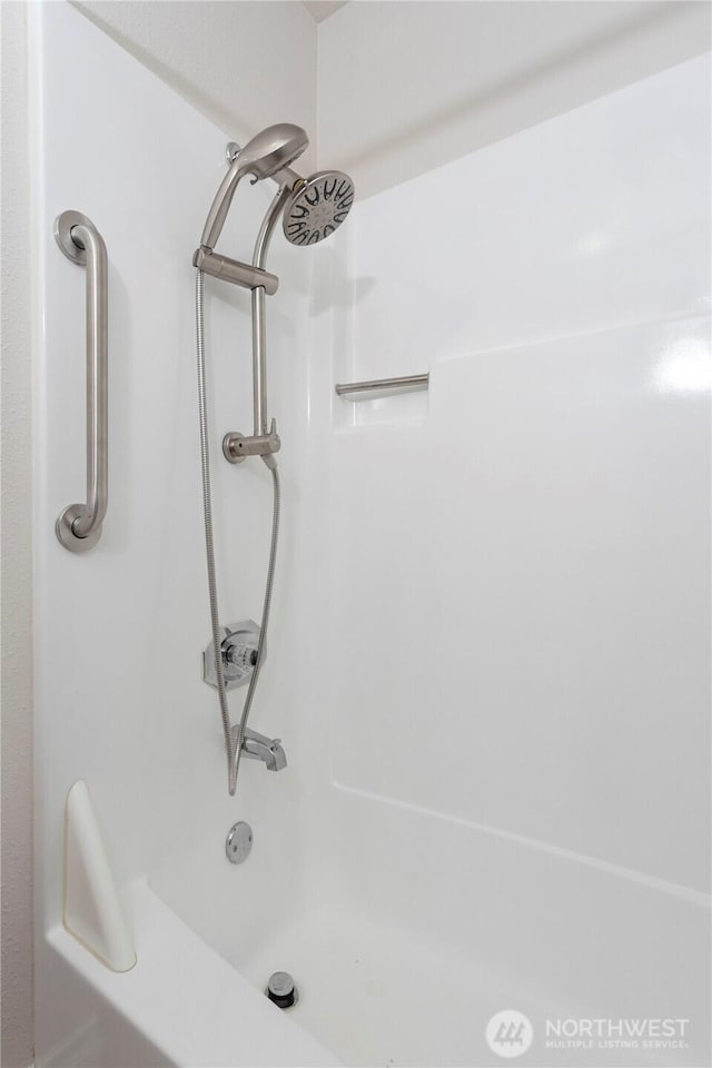 bathroom featuring a tub to relax in and walk in shower