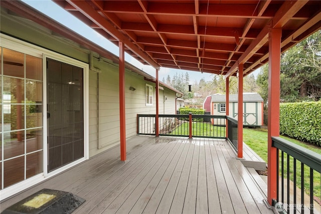 deck featuring an outbuilding and a shed