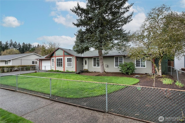 ranch-style home with a fenced front yard, driveway, a garage, and a front lawn