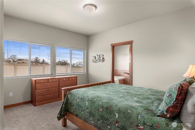 bedroom featuring light colored carpet