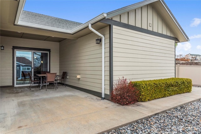 view of side of home with a patio