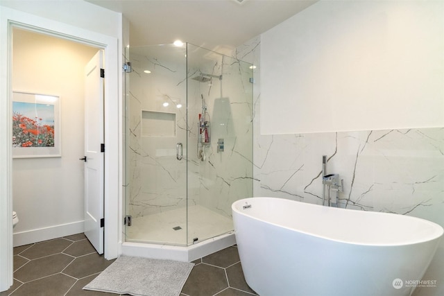 bathroom featuring independent shower and bath, toilet, and tile patterned floors