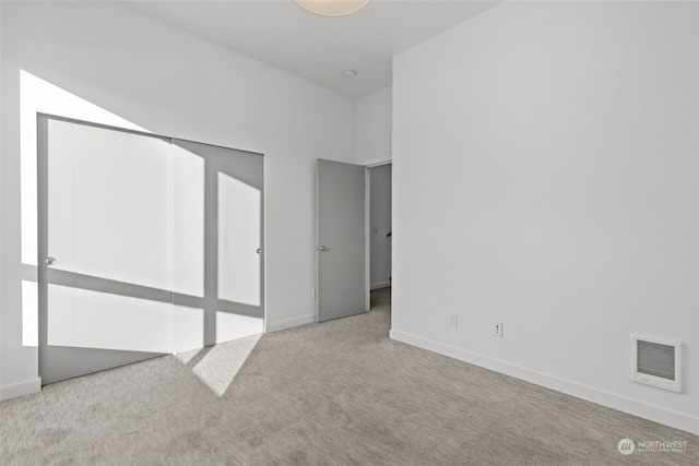 unfurnished bedroom featuring light colored carpet