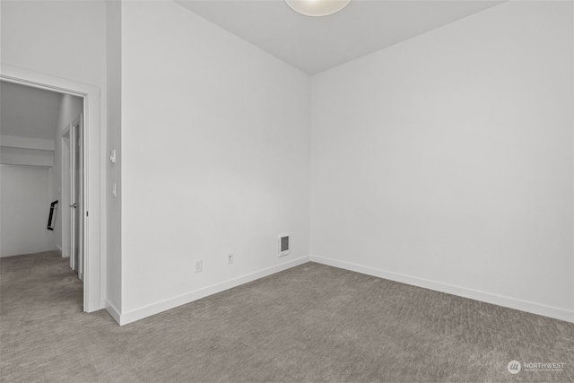 empty room featuring light colored carpet