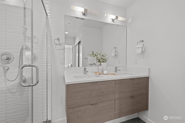 bathroom with walk in shower and vanity