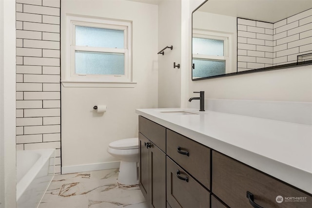 full bathroom featuring vanity, tiled shower / bath combo, plenty of natural light, and toilet