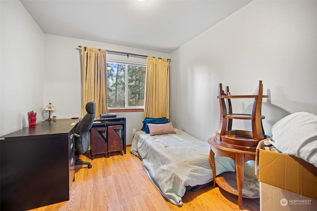 bedroom with light wood-type flooring