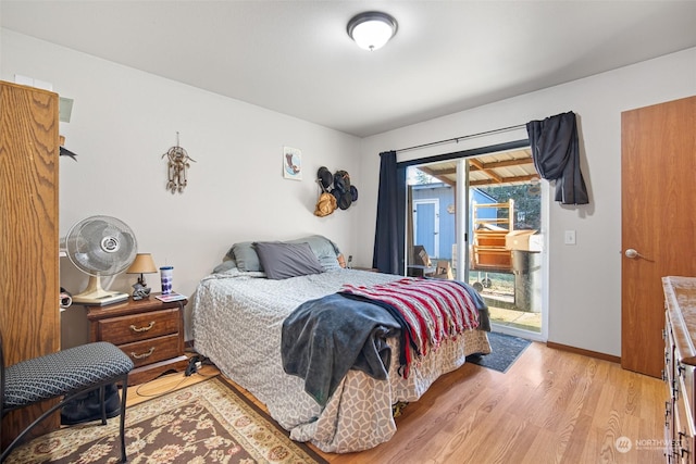 bedroom featuring access to outside and light hardwood / wood-style floors