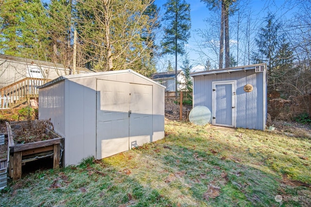 view of outbuilding featuring a lawn