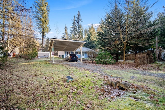 view of yard with a carport