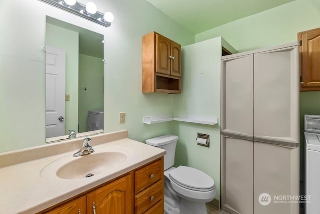 bathroom with toilet and vanity