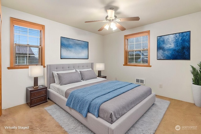 carpeted bedroom with ceiling fan