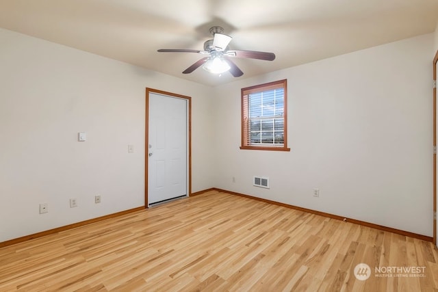 spare room featuring ceiling fan and light wood-type flooring