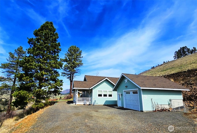 exterior space featuring driveway and covered porch