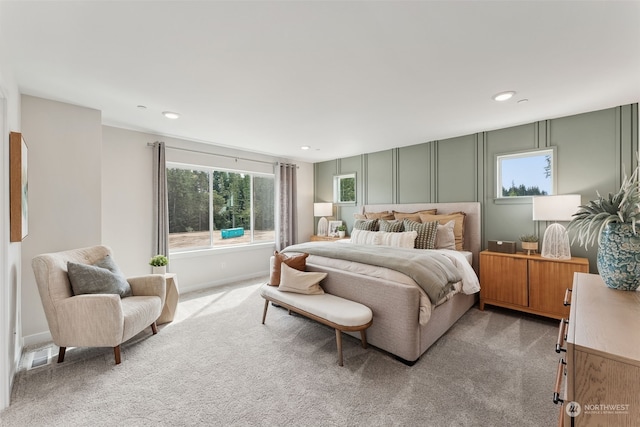 bedroom featuring light colored carpet