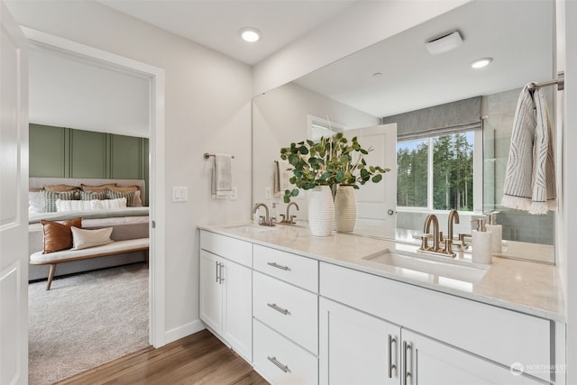 bathroom featuring vanity and hardwood / wood-style floors