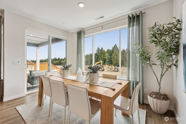 dining area with light wood-type flooring