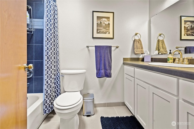 full bathroom featuring shower / tub combo with curtain, vanity, toilet, and tile patterned flooring