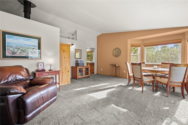 living room featuring carpet flooring and vaulted ceiling